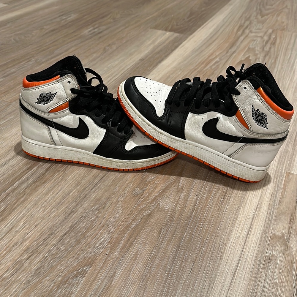Nike air Jordan black, white and orange size 6.5Y size 8 women’s